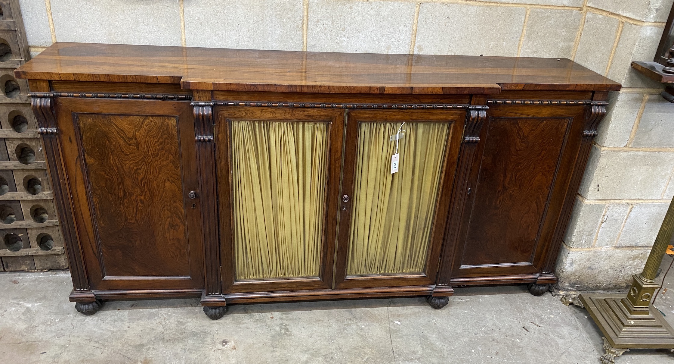 A William IV rosewood breakfront side cabinet, width 199cm, depth 42cm, height 97cm, NB: From the Estate of Rt Hon Lord Lawson of Blaby